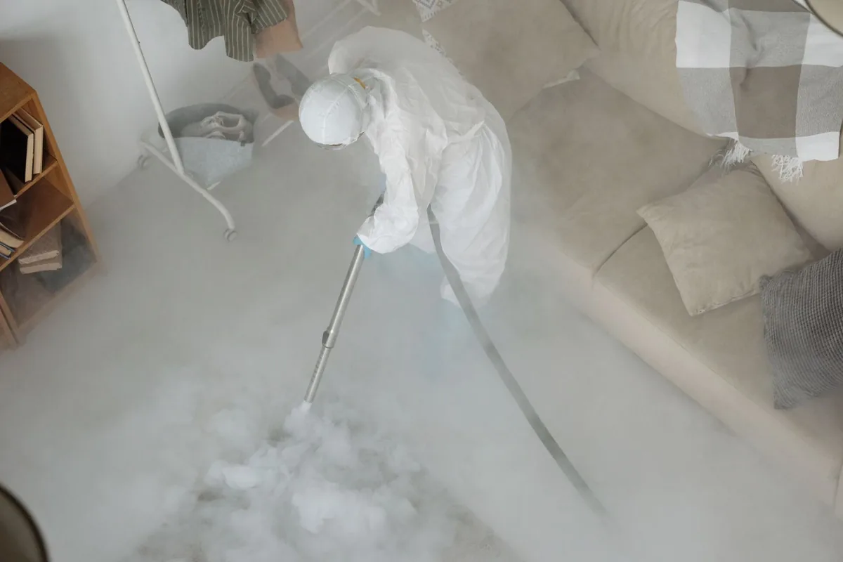 Biohazard cleanup technician in protective equipment, Mogadore, OH